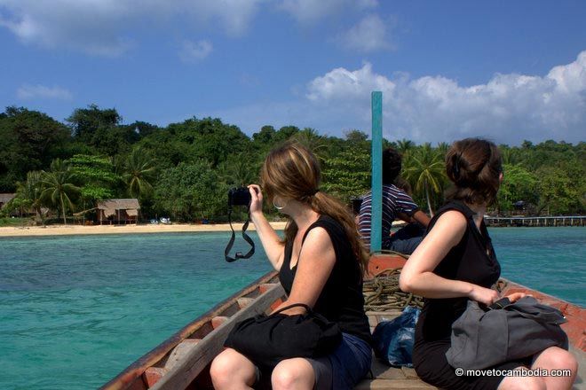 The Move to Cambodia team In a boat, pulling up to Koh Totang, Cambodia