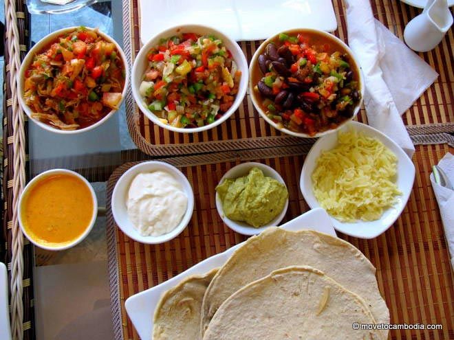 Mexican in Phnom Penh A table covered with the makings for roll-em-yourself tacos at La Cita, in Phnom Penh.