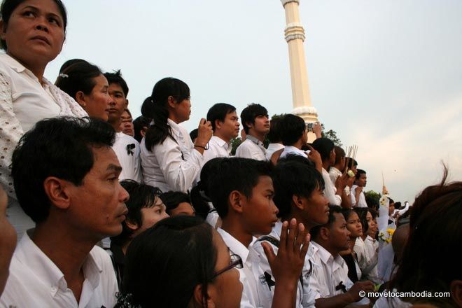 Boy praying A young boy waits for hours to see King Father Norodom Sihanouk's casket return to Phnom Penh.