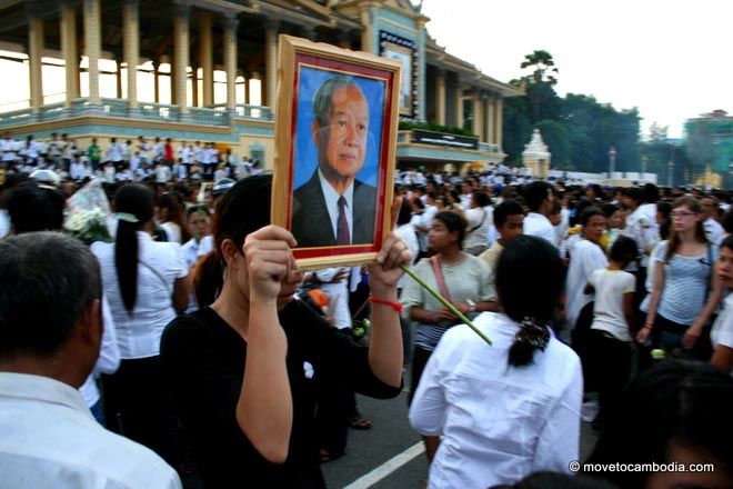 A Cambodian woman carrying a photo of Norodom Sihanouk