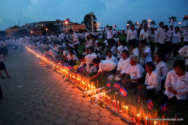 Lighting candles for Norodom Sihanouk A row of flags, candles and joss sticks to commemorate King Father Norodom Sihanouk