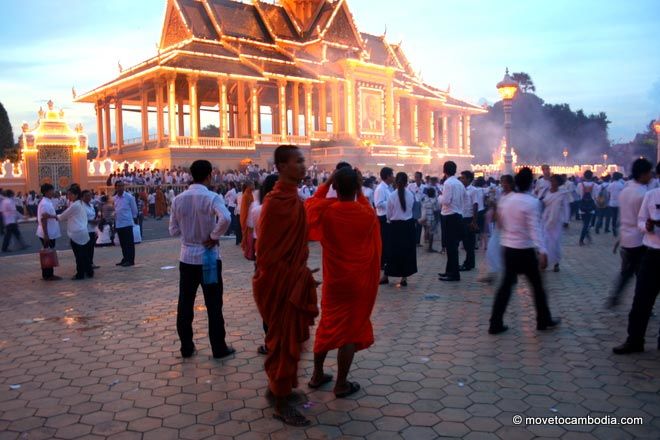 Monks at dusk in front of Royal Palace Monks at dusk in front of Royal Palace