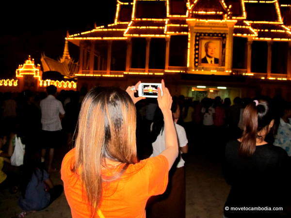 Norodom Sihanouk 3 A Cambodian woman taking a photograph of the Royal Palace.