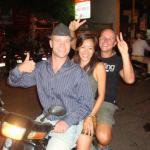 Ramon Stoppelenburg driving a moto with two passengers in Cambodia