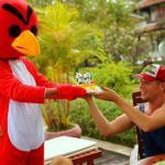 Andy receiving a birthday cake from an Angry Bird