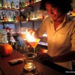 Hong Kry makes a drink with flair in a real tuk tuk at Siem Reap's Tuk Tuk Bar.