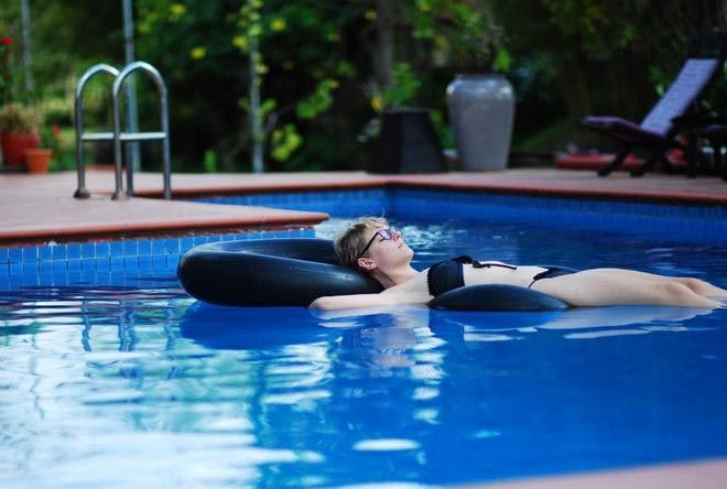 kristin relaxing Kristin O'Connell relaxing in a pool