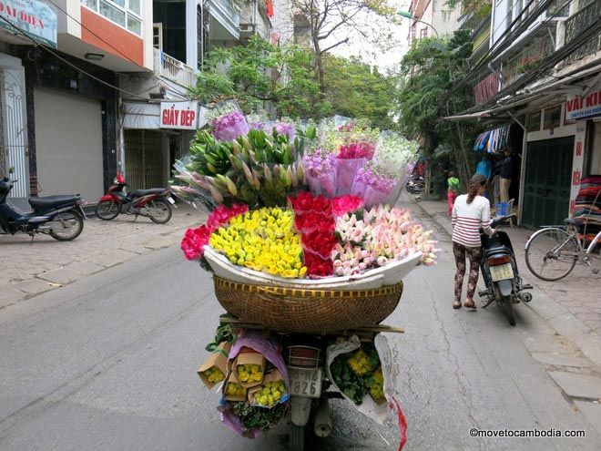 Hanoi A motobike with a giant basket of flowers on the back in Hanoi.