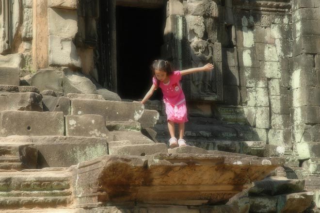 angkor child at Angkorian temples